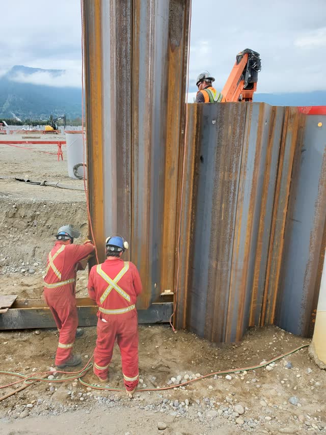 Crew working a sheet-pile wall installation