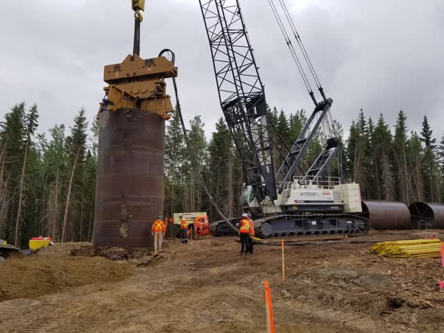 Large-diameter casing being driven on a cleared right-of-way