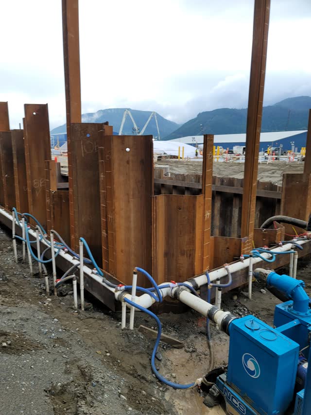 Sheet-pile excavation with dewatering pumps in service
