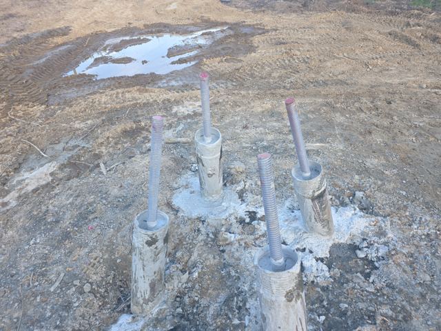 Completed micropile heads with threaded bar projecting for cap connection