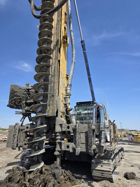 Continuous flight auger rig mid-cycle on a production CFA pile program