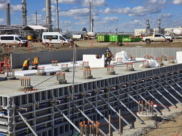 Formwork and anchor-bolt cages set for equipment foundations at a process facility